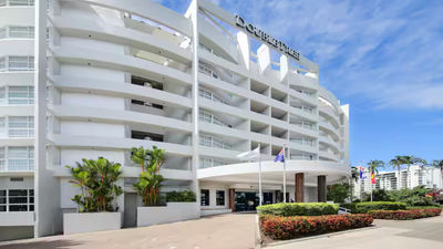 Guests at the DoubleTree by Hilton in Cairns were evacuated after a helicopter crashed on the hotel’s roof.