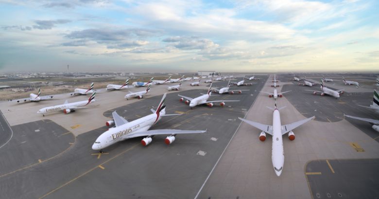 Emirates planes fill the runways and aprons at Dubai World Central.