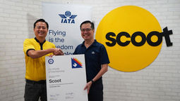 Scoot's CEO Leslie Thng receives the IATA certification from IATA's regional vice president for APAC Philip Goh.