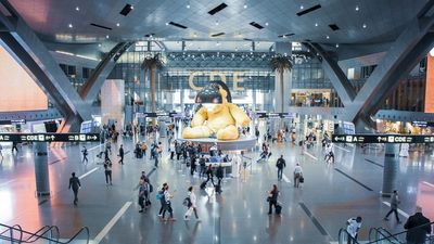 Grand Foyer of Hamad International Airport, with an the oversized “Lamp Bear” as its artistic centerpiece.