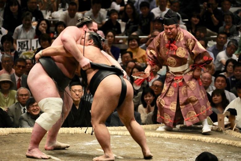 Will it be cancelled, or will it not? Doubts remain whether the Tokyo Olympics will go ahead in 2021. Pictured: Sumo wrestlers in action.
