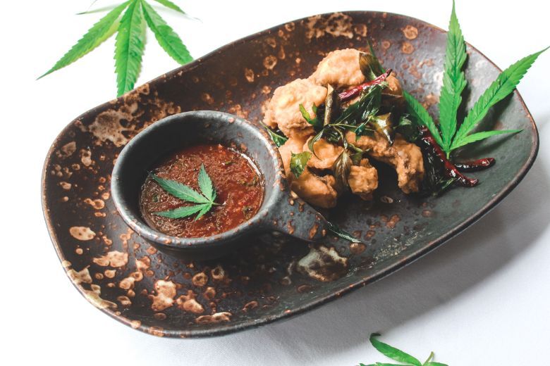 Deep-fried seabass with crispy cannabis and cannabis tamarind sauce, one of the signature dishes at The Service 1921 Restaurant and Bar.