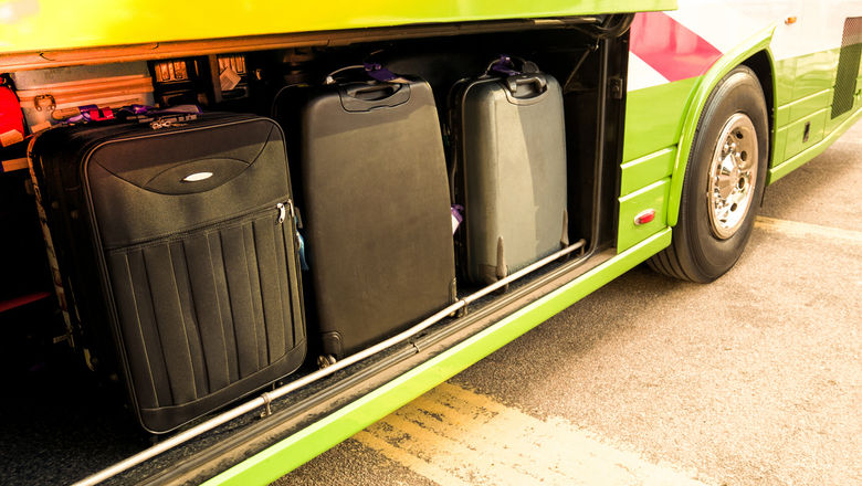 The woman crawled into the bus luggage compartment to retrieve her luggage which was situated deep inside, only for the bus driver to close the door behind her.