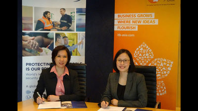 Juliana Gim (left), managing director of International SOS Singapore and Katrina Leung, executive director of Messe Berlin (Singapore) seal a partnership.