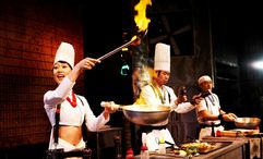 Cookin’ NANTA is a non-verbal Korean stage show mixing comedy, acrobatics, and percussion with kitchen utensils in a high-energy culinary performance.