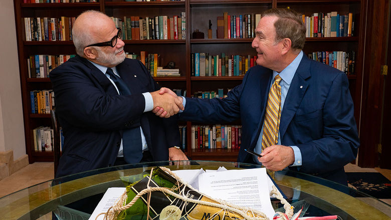 Silversea Cruises' executive chairman, Manfredi Lefebvre (left), and Royal Caribbean Cruises Ltd.'s chairman and CEO, Richard D. Fain, ink RCL's investment in Silversea Cruises.