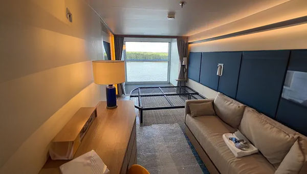 A Family Infinite Balcony Suite on Icon of the Seas. The top half of the balcony window can open and close electronically. A Family Infinite Balcony Suite on Icon of the Seas. The top half of the balcony window can open and close electronically.
