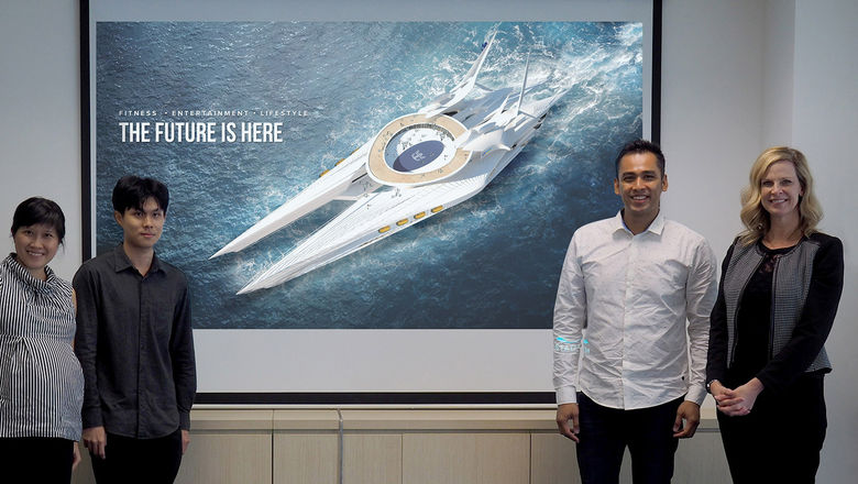 Grand-prize winner Clifford Goh (second from left) showcasing the aerial view of his cruise ship design. From left: Jiali Wong, Clifford Goh, Khairudin Saharom, Angie Stephen.