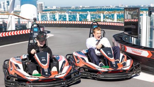 Jeff Gordon and Rob Gronkowski race on the Norwegian Encore's go-kart track. Jeff Gordon and Rob Gronkowski race on the Norwegian Encore's go-kart track.