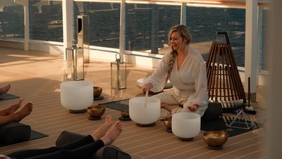 Guests can enjoy yoga, sound healing, and wellness activities at sea with Explora Journeys.