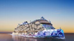 The hull art of Norwegian Luna, designed by street artist ELLE, reflects moonlight on the sea, celebrating humanity's connection to celestial forces.