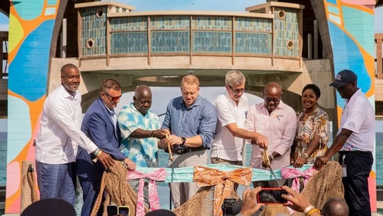 Royal Caribbean Group executives and Bahamian officials cut the ribbon on Royal Beach Club Paradise Island.