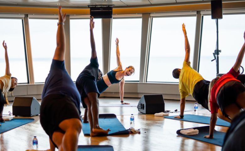 A workout session with celebrity yoga instruction Denise Keller onboard World Dream.
