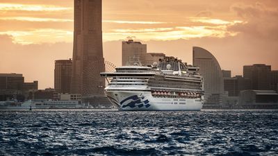 Diamond Princess sails out of Yokohama at sunset.