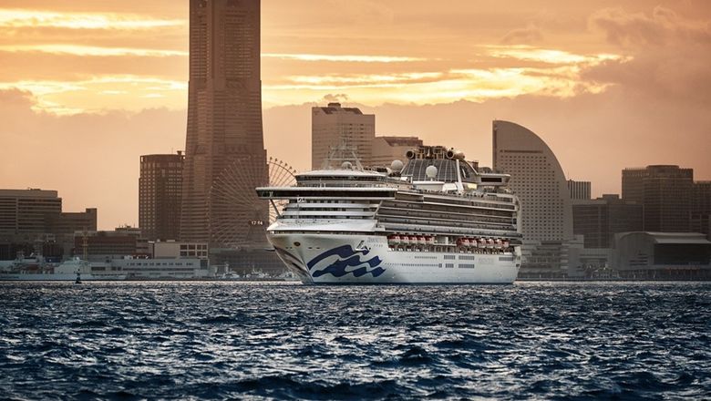 Diamond Princess sails out of Yokohama at sunset.