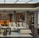 The Skyview Regent Suite’s formal dining area includes a grand table, built-in serving credenzas, a glass-enclosed bar, and a skylight.