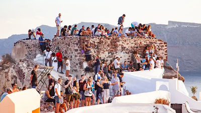 Visitors in Oia, Santorini, waiting to catch the sunset.