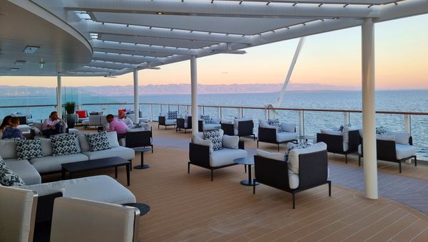 Silver Nova's Dusk Bar on deck 10 offers an exquisite setting for pre-dinner cocktails and sunset views.