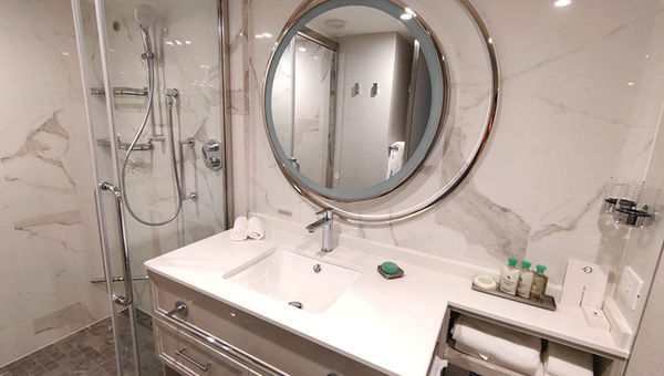 Vista's bathrooms have rainforest showers, abundant storage, and backlit mirrors.