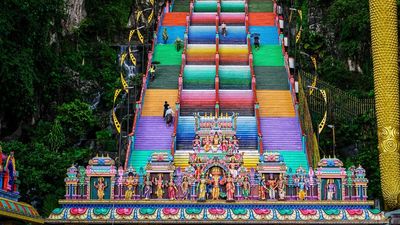 The 272 steps leading to the limestone caves have been painted in bright colours.