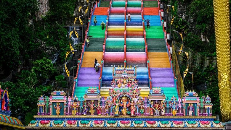 The 272 steps leading to the limestone caves have been painted in bright colours.