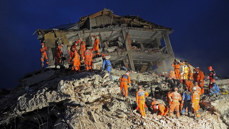 Rescuers and volunteers are working through the night to extricate victims trapped in rubble.