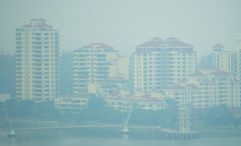 Haze shrouds waterfront residential towers at Tanjong Rhu, Singapore.
