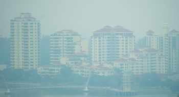 Haze shrouds waterfront residential towers at Tanjong Rhu, Singapore.