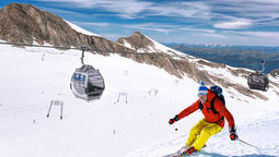 Skiing downhill from high mountains in Zell am See, Austria.