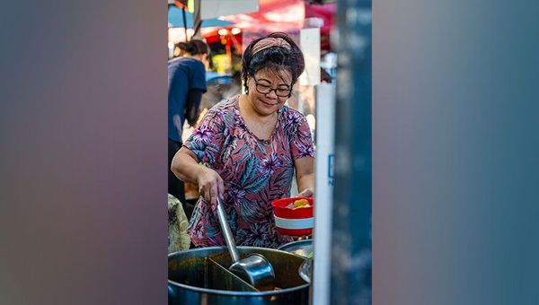 Guo Yang Yei creates her laksa fresh from scratch at Parap Markets, Darwin.
