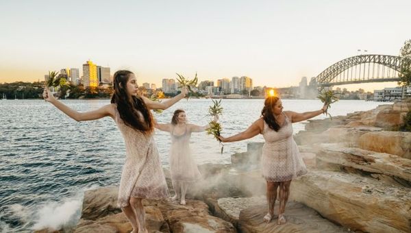 Aboriginal dancers sharing an immersive cultural experience during an Aboriginal Cultural Tour in Barangaroo, Sydney.