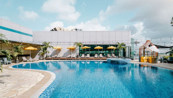 Changi Airport features a rooftop pool at Aerotel Transit Hotel in Terminal 1, offering runway views, a jacuzzi, and a poolside bar.