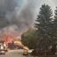 Major tourist town burns in huge wildfire