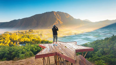 Mount Rinjani, Lombok’s iconic volcano, stands at 3,726 metres, offering adventurous treks, breathtaking crater lakes, hot springs, and lush tropical landscapes in a national park setting.