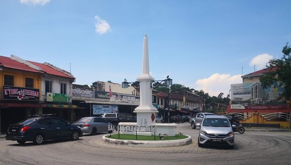 Balik Pulau boasts seasonal durians, heritage shops, scenic orchards, historical landmarks, and delicious local snacks, offering a charming blend of nature and culture.