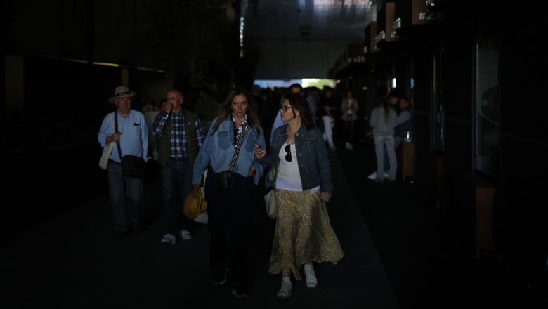 Commuters at train stations were plunged into darkness during the outages, with halted services forcing many to walk along tracks and tunnels to the exit.