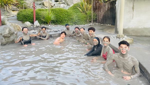 Hell's Gate in New Zealand offers a unique outdoor mud bath experience, traditionally used by Māori for therapeutic purposes.