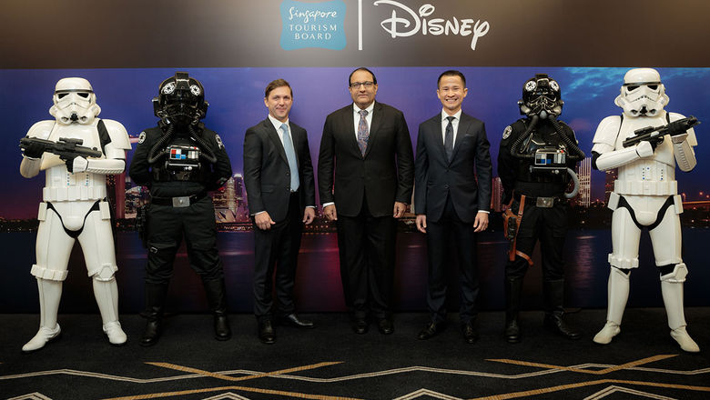 (from left) Alex Baillie, head of marketing and partnerships, The Walt Disney Company Southeast Asia; S Iswaran, Minister for trade and industry (industry); and Lionel Yeo, chief executive, STB posing for a shot with the Stormtroopers.