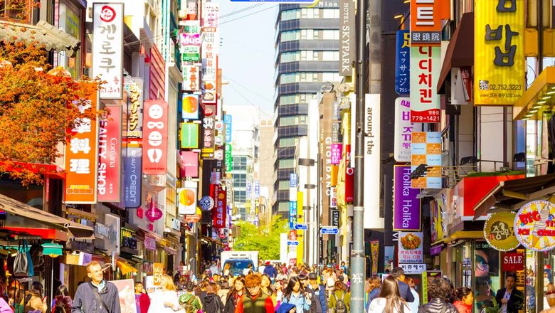 Caption: Myeongdong, a popular shopping district in Seoul, South Korea.