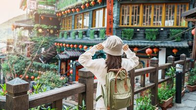 The gift bag includes passes for Taipei's attractions, vouchers for experiences like tea, pineapple sets, accommodations, and wedding photography discounts.
