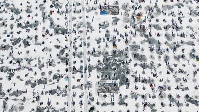 Visitors can try their hand at catching “bingeo” or silver fish at one of 2,300 holes dug for the wintertime activity in Inje, Gangwon province.