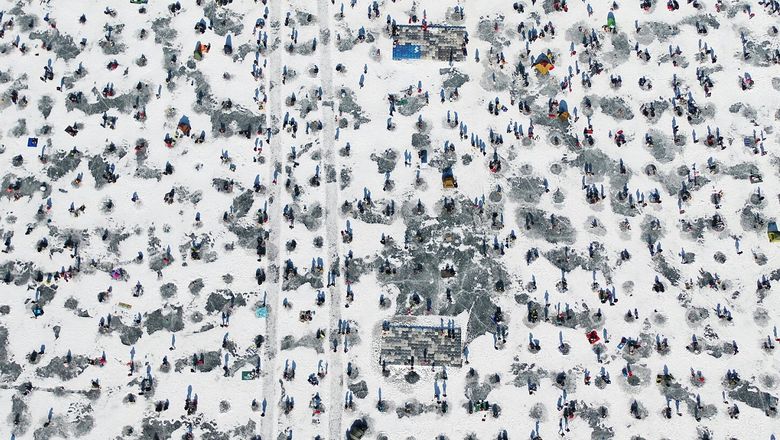 Visitors can try their hand at catching “bingeo” or silver fish at one of 2,300 holes dug for the wintertime activity in Inje, Gangwon province.