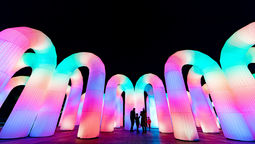 Sky Castle is a giant inflatable arch installation that reacts to movement with colour and sound, symbolising hope and joy after hardship.