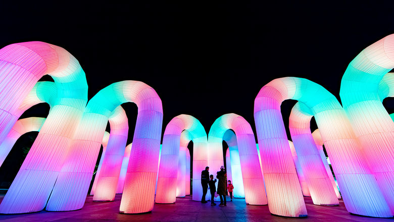 Sky Castle is a giant inflatable arch installation that reacts to movement with colour and sound, symbolising hope and joy after hardship.