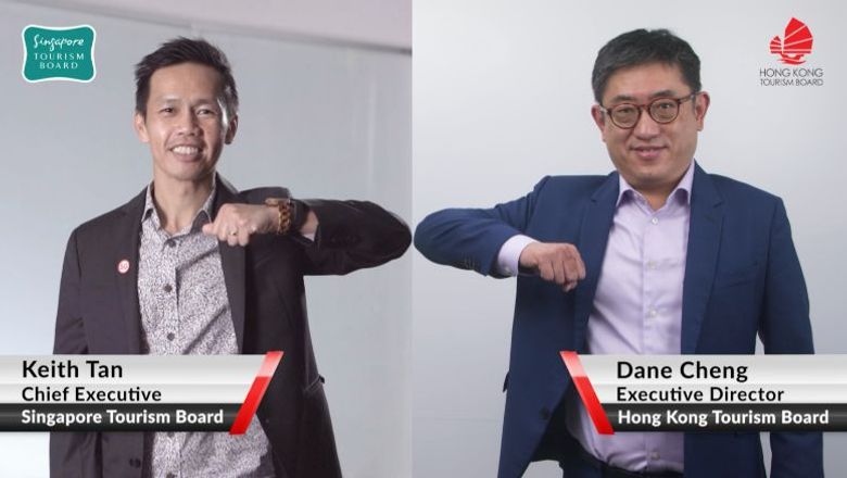 STB's Keith Tan and HKTB's Dane Cheng welcome the launch of the Hong Kong-Singapore Air Travel Bubble with virtual elbow bumps.