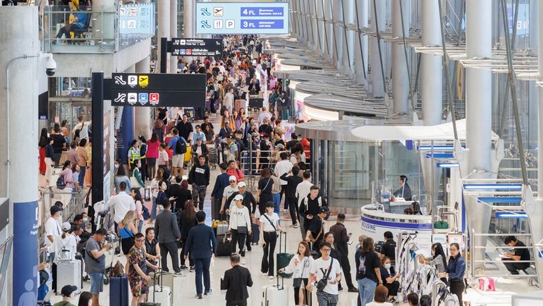 Thai health authorities screen arriving air passengers.