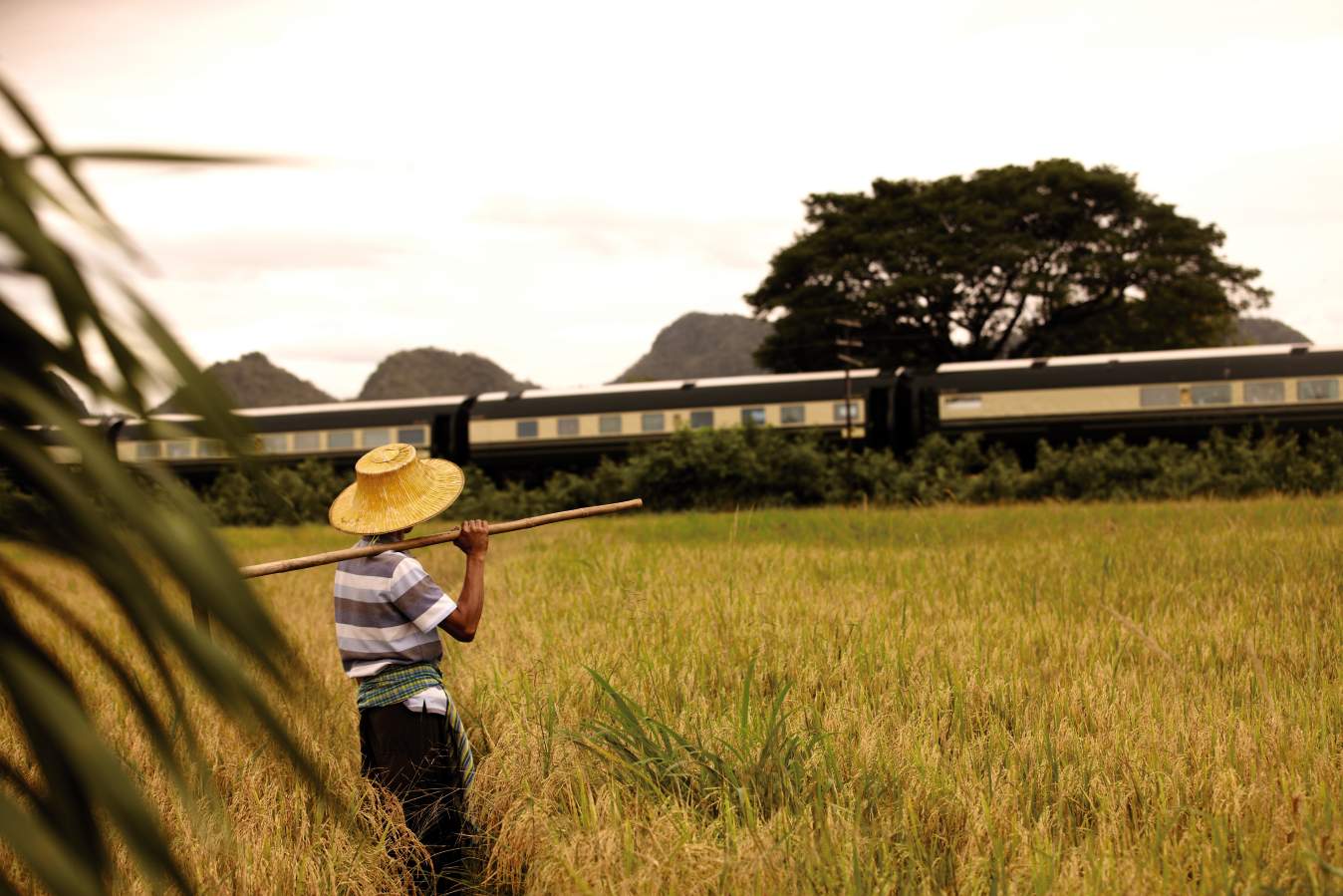 Farmer waving to The Eastern & Oriental Express
