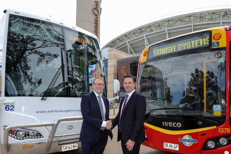 Deal done: Jeff Allison and Clint Feuerherdt  shake on a major transport acquisition spanning Australia, London and Singapore.