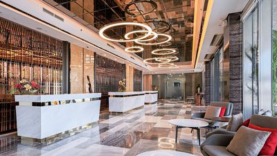 The lobby of Best Western Plus Metro Clark welcomes guests with a modern and inviting ambiance, showcasing a blend of style and functionality.