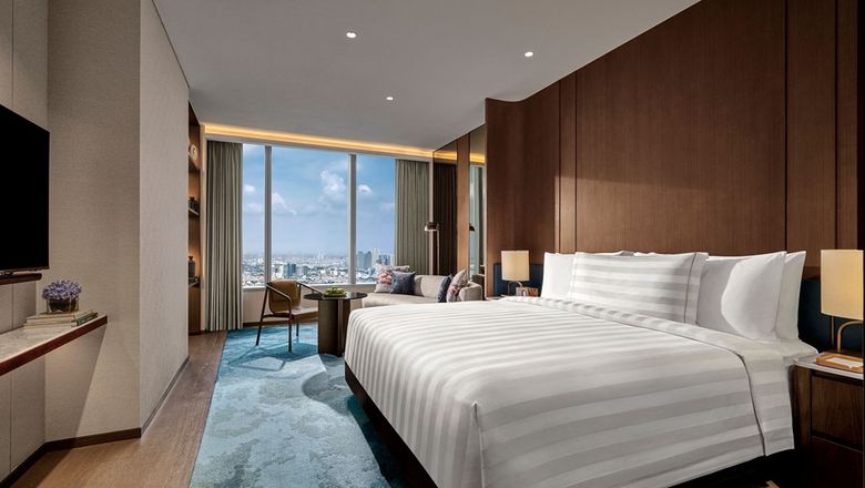 The 158 rooms and suites feature chic aesthetics, avant-garde designs, panoramic city views, and personalized pillow menus for restful sleep.